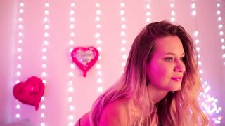 A Beauty in Romantic Lingerie Puts Her Hand Into Her Panties