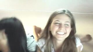 Sexy petite lesbians teasing the camera in a close up